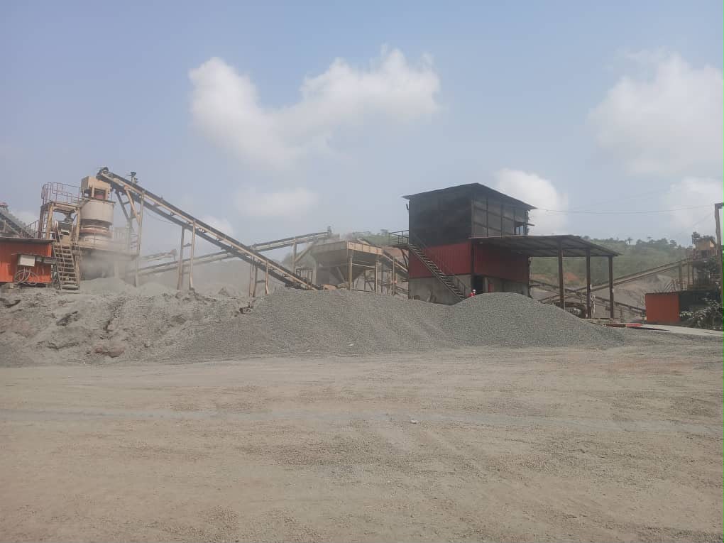Stone crushing plant with conveyors and aggregate stockpiles